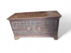 A Cypriot dowry chest with carved features on the front bo
