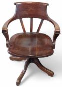 A stained-oak captains chair