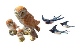 A set of three Beswick pottery wall mounted swallows in flight
