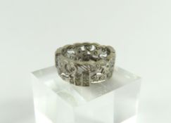 A contemporary white gold diamond set band ring, t