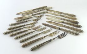 A collection of silver forks and knives