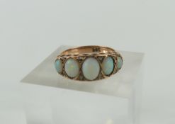 A rose gold white opal five stone ring, the oval c