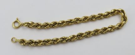 An unmarked hollow rope link bracelet,