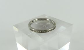 A platinum diamond set half eternity ring, finger