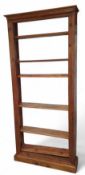 A continental open stained pine bookshelf