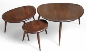 A dark Ercol-style nest of tables