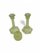 A 20th century pair of uranium glass candlesticks
