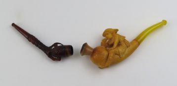 A pair of cased pipes. One dark, with four talon c