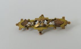 A Victorian two colour gold brooch, set with a sma