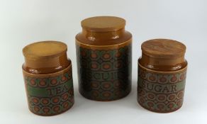 Three Hornsea pottery jars with glossed patterns and text