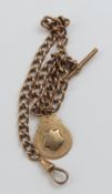 A 9ct rose gold watch chain with oval curb links indivi