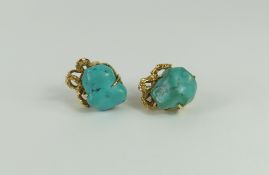 A pair of screw on earrings, each set with a piece