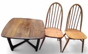 A mid century style table with chairs