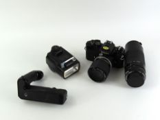 A Nikon FE camera with lens and handle