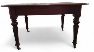 A mahogany extendable dining table