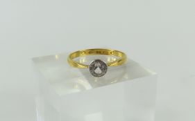 A 22ct gold Victorian old cut white stone solitair