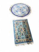 Two brightly coloured rugs