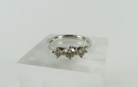 A platinum diamond three stone ring, the three gra