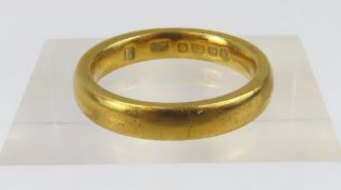 A 22ct gold wedding band, finger size L 1/2
