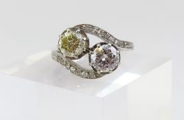 An unusual two stone diamond cross over or toi et