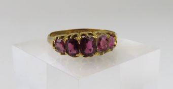 A Victorian 15ct gold five stone garnet ring, the