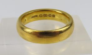 A 22ct gold wedding band, made by The Albion Chain