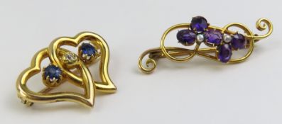 A brooch composed of two intertwined open hearts,