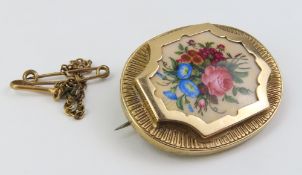 A 19th or 20th century enamel brooch, the centre p