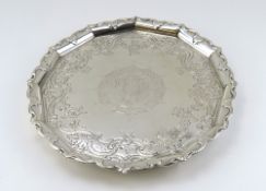 A large silver salver with smooth body