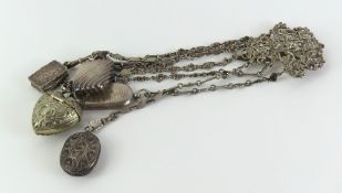 A silver chatelaine with chains