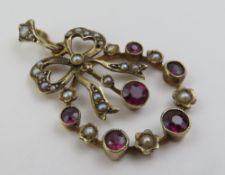 An early 20th century garnet and split pearl penda