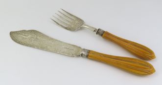 A silver serving knife and fork