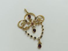 A 9ct gold Edwardian style pendant, set with rubie