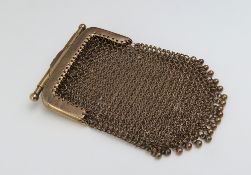 A gold chain mail purse, marked '9ct'