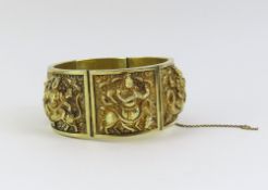 An embossed Anglo-Asian panel bracelet, the six pa
