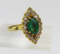 An 18ct gold emerald and diamond dress ring, in a