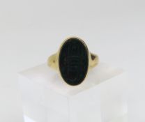 A bloodstone seal engraved signet ring, the oval s