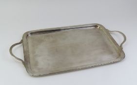 A plain silver tray with round