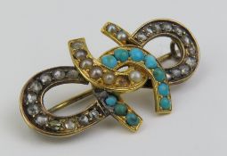 A 19th century quadruple horseshoe brooch, the two