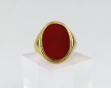 A carnelian set signet ring, the large oval carnel