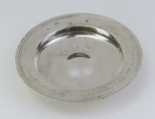 A silver dish, modestly designed with smooth body,
