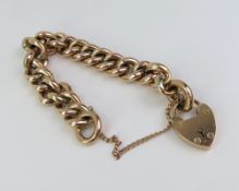 A 9ct rose gold curb link bracelet composed of hollow links