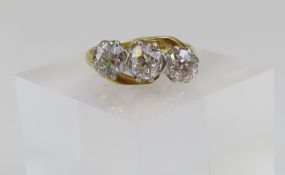 A three stone diamond twist ring, the three slight