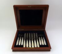 A mahogany case of Victorian silver