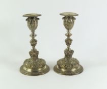 A pair of decorative silver candlesticks