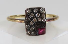 An early 20th century ruby and diamond plaque ring