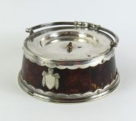 A silver plate and tortoise shell dish