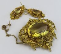 A 19th century citrine set brooch, the oval facett