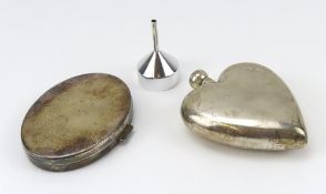 A marked silver heart-shaped scent bottle