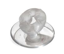 A glass Lalique fox curled over a dish base; marke